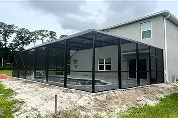 Bronze half mansard style pool enclosure by East Coast Aluminum